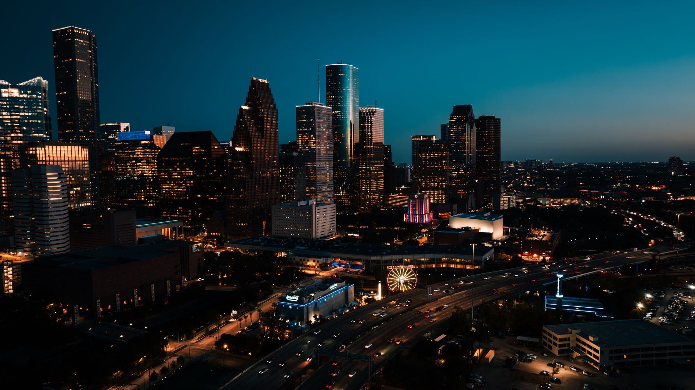 Downtown Houston's skyline lit up at dusk